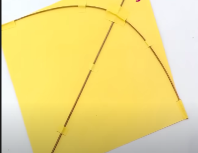 A picture containing text, yellow, umbrella, accessory Description automatically generated